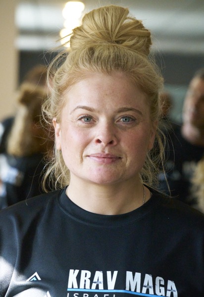 Gemma - Head Krav Maga instructor at AMK Canterbury demonstrating martial arts training